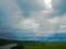 Summer panorama before a thunder-storm field a river and a forest in the distance, in the Russian