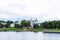 Summer panoramic view of the embankment of Volga River with monument to Athanasius Nikitin and Church of the Three Confessors in