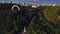 Summer park on river embankment in modern city. Aerial view urban architecture