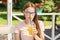 Summer party, teen girl with refreshing lemonade in hand beach cafe