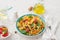 Summer pasta with tomatoes, herbs and olive oil