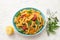 Summer pasta with tomatoes, herbs and olive oil