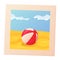Summer photo. Bright infatible beach ball on sand. Red, yellow, blue stripes rubber toy. Vacation leisure concept.