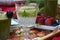 A summer picnic - A glass of minty lemonade in a crystal stem glass on a picnic tray