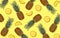 Summer pineapple fruit pattern on a yellow background