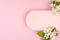 Summer pink blank rounded horizontal rad for text mockup with white apple tree flowers fly on pastel pink background. Romantic.