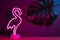 Summer pink flamingo and monstera leaf with neon pink and blue light.vacation background