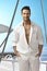 Summer portrait of handsome man on sailing boat