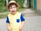 Summer portrait toddler boy in straw hat.