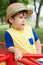 Summer portrait toddler boy in straw hat.