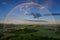 Summer rainbow over Czech Bohemian Highlands hills, Czech republic. Rainy sunset.