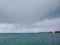 Summer rains over entrance to North Bimini channel, Bahamas.