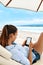 Summer Relaxation. Woman Reading, Relaxing On Beach. Summertime