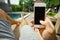 Summer rest. Relax in the hotel with a phone in hand. A man lying on a lounger by the pool and enjoying your smartphone.