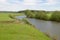 Summer rural landscape with a river, forests, hills