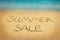 Summer sale letters on sand