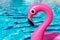 Summer sale. Pink inflatable flamingo in pool water for summer beach background. Minimal summer concept