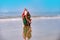 Summer Santa on sand. Holiday concept. Christmas vacation background.