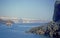 Summer scene with volcanic island Santorini with caldera, rocks and a tourist ship