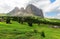 Summer scenery of rugged Alpine mountains with view of rocky Sassolungo-Sassopiatto