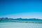 Summer sea and empty pier. Tropical beach in the beginning of the summer