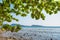 Summer seascape on tropical Phuket island in Thailand. Landscape taken on main long sunrise beach with blue sky and white sand