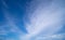 Summer Serenity: Fluffy Cirrus Clouds Painting the Blue Sky