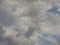 Summer sky seen from behind rain-splashed glass