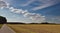 summer skyscape and agricultural landscape after the harvest