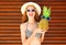 Summer smiling woman with funny pineapple in sunglasses