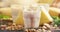 Summer smoothies with banana, pineapple and granola, dark kitchen table background, selective focus