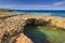 Summer on solitary beach. Salento coast: it`s characterized by small sandy coves and cliffs, rocky arch and sea stacks . Apulia,