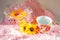 Summer still life of bright dishes and pink napkins