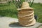 Summer straw natural fiber weave caps . A basketry hat, top view . Hats from natural materials, reed leaves