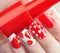 Summer style red manicure with strawberries and polka dots