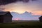 Summer Sun Sets Between The Barn Houses