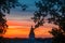 Summer sunset and beautiful sky above the historical town and Jaani kirik St. John`s Church in Tartu, Estonia