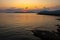 Summer sunset landscape over the Gulf of Alghero at Mediterranean Sea - Sardinia, Italy - with cliffs of Capo Caccia cape and