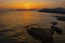 Summer sunset landscape over the Gulf of Alghero at Mediterranean Sea - Sardinia, Italy - with cliffs of Capo Caccia cape and