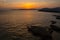 Summer sunset landscape over the Gulf of Alghero at Mediterranean Sea - Sardinia, Italy - with cliffs of Capo Caccia cape and