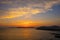 Summer sunset landscape over the Gulf of Alghero at Mediterranean Sea - Sardinia, Italy - with cliffs of Capo Caccia cape and