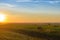 summer sunset over a mown field