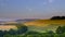 Summer sunset over the South Downs - high resolution stitched panorama of golden hour light falling on Butser Hill from above East