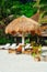 Summer sunshade and sunbed on the tropical white sand beach. nipa sunshade and bamboo sunbed