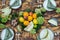 Summer table set. Dining outside. Wooden table decorated fresh flowers and summer fruits.