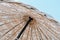 Summer texture and background. Wicker lattice roof of beach umbrella.