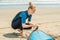 Summer time and active rest concept. Young surfer woman beginner