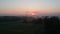 Summer time beautiful sunrise and mist in farmland, aerial