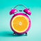 Summer time concepts with orange alarm clock on blue pastel background