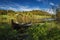 Summer time by the Jonsvatnet lake, middle Norway. |Wooden paddle boat by the shore